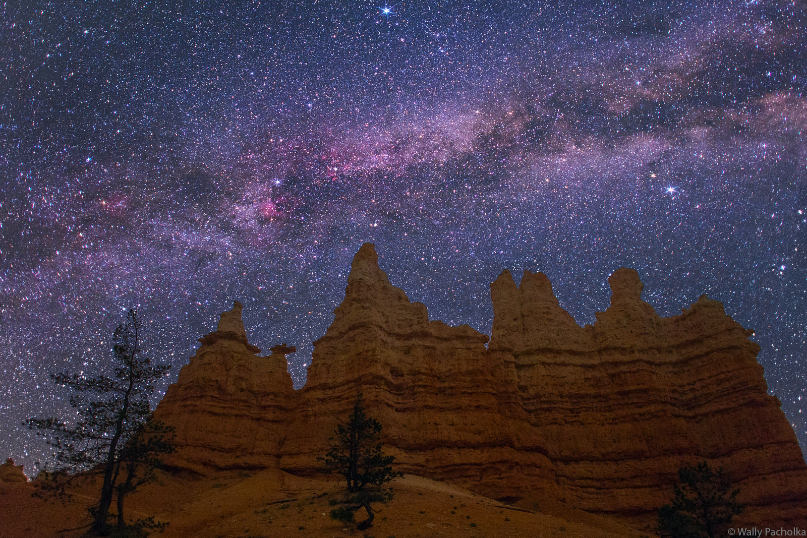 Queen and Court under Milky Way Arch The Milky Way arches over Queen and Court in Bryce Canyon.