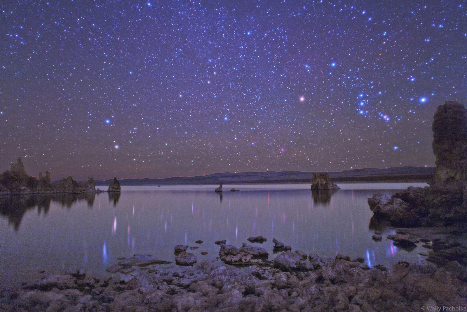 Mono Lake reflects the constellations of the Gemini Twins and Orion in California.