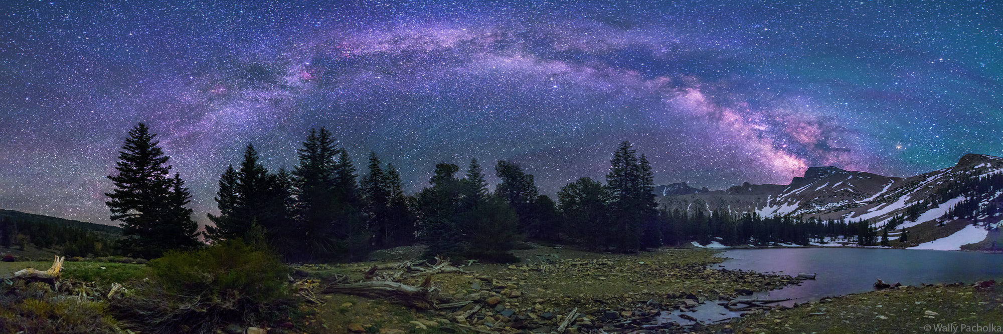 The arch of the Milky Way reaches down to touch Stella Lake in Great Basin National Park.