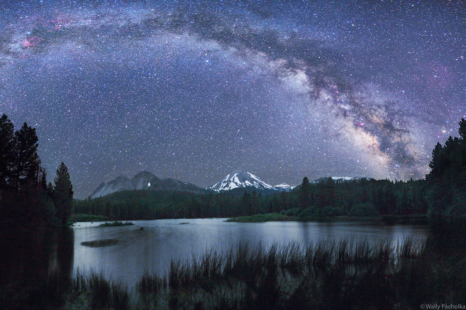 The Milky Way rises above Lake Manzanita at Lassen Volcanic National Park.